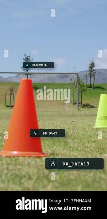 Vertical video: Soccer player entering frame, dribbling ball around ...