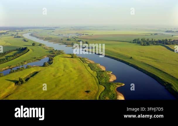 Morning Rural Vector Aerial view of winding Elbe River and green countryside in Germany ...