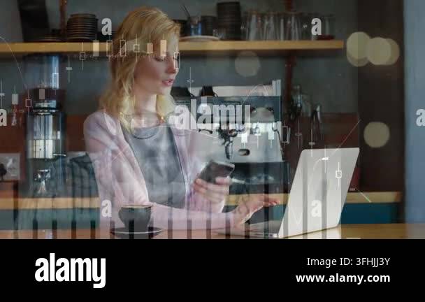 Glanicing Glancing right, woman in gray apron tapping laptop checking phone over ...