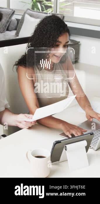 Vertical video: Partners handing page and typing at desk starting ...