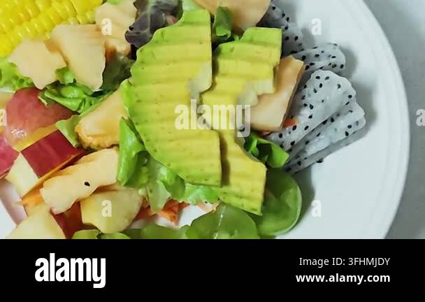 Alternative View Of A Healthy Fresh Salad With Avocado And Dragon Fruit 