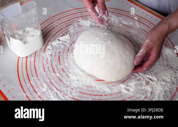 Food Factory Process Woman baking homemade bread or pastry at kitchen counter. Cooking ...