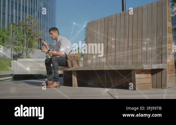 Man tapping phone and adjusting earbud, initiating animated tech nodes ...