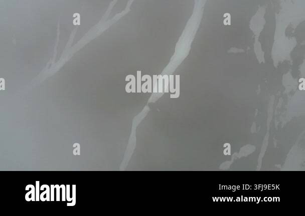 The video captures a series of abstract patterns formed by light and ...