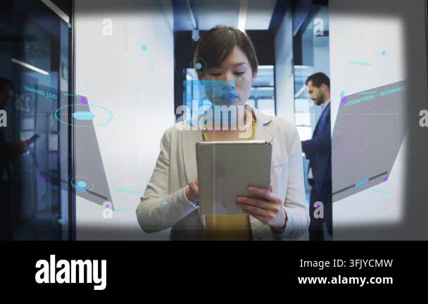 Glanicing IT woman glancing up then tapping tablet, bringing up AR panels while ...