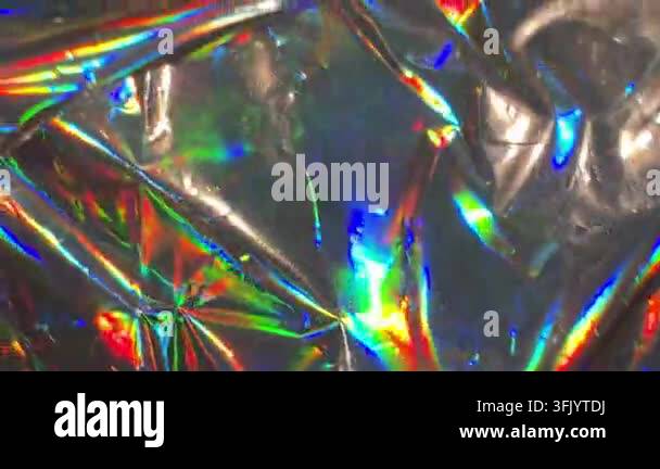Close-up of crinkled iridescent holographic foil showing vibrant ...