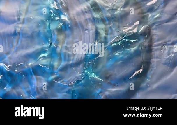 Close-up view of translucent gel formations in vibrant blue, purple ...