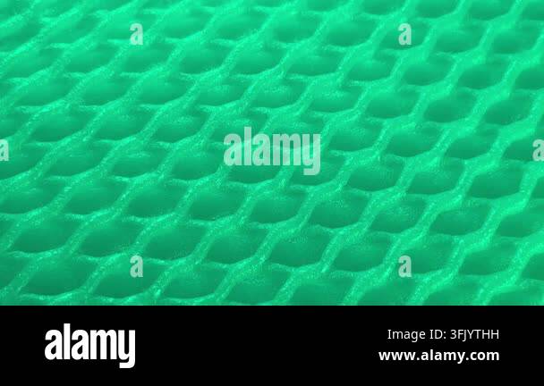 Abstract background featuring a textured grid pattern illuminated with ...