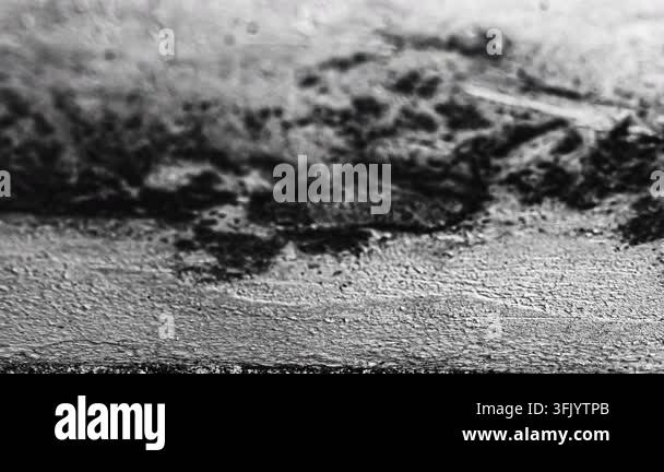 A detailed black and white abstract texture showcasing layers of rough ...