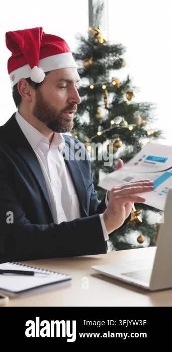Ochart Background A man in a Santa hat presents a growth chart during a holiday-themed ...