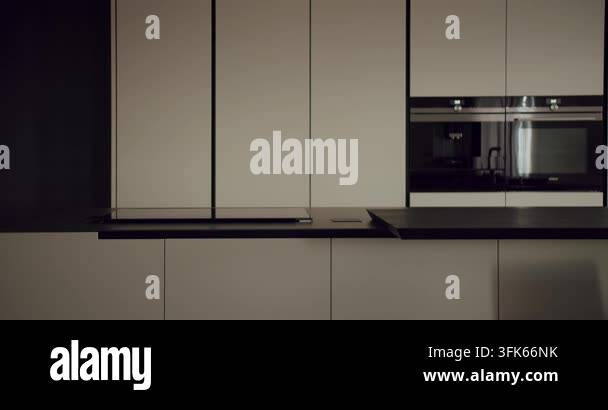 Dark stylish kitchen interior displays a minimalist design with sleek ...