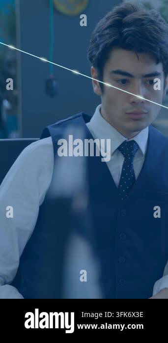 Vertical video: Man at desk viewing screen while screen sending device ...