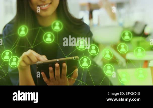 Woman tapping tablet in office activating social network overlaying ...