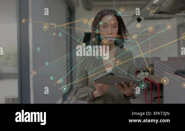 Vertical video: Woman tapping tablet in office, nodes growing and ...