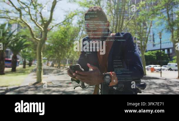Man leaning on bicycle, tapping smartphone and bringing up tech overlay ...