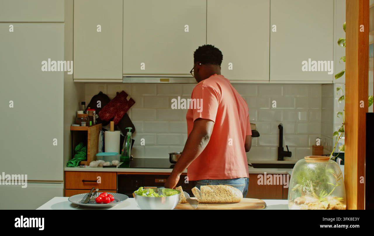 Man cuts fresh loaf of bread Stock Video Footage - Alamy