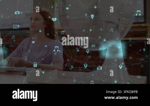 Animation of media icons over caucasian businesswoman using computer ...