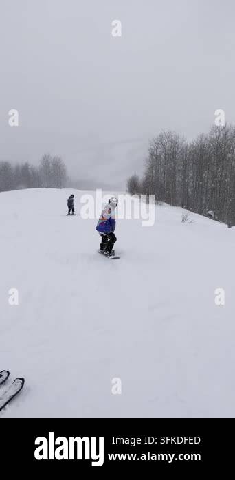 Snow Ridier Video of a snowboarder riding down a slope. Live footage of a ...