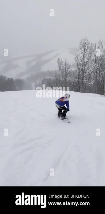 Snow Ridier Video of a snowboarder riding down a slope. Live footage of a ...