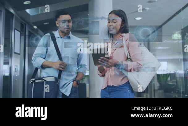 Woman tapping tablet and activating AR overlay over screen, man leaning ...