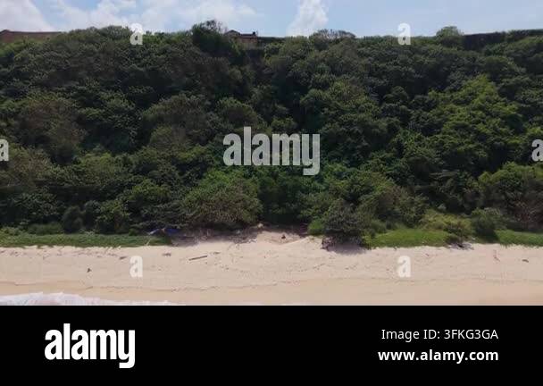 Aerial drone video of a tropical beach with turquoise ocean water ...