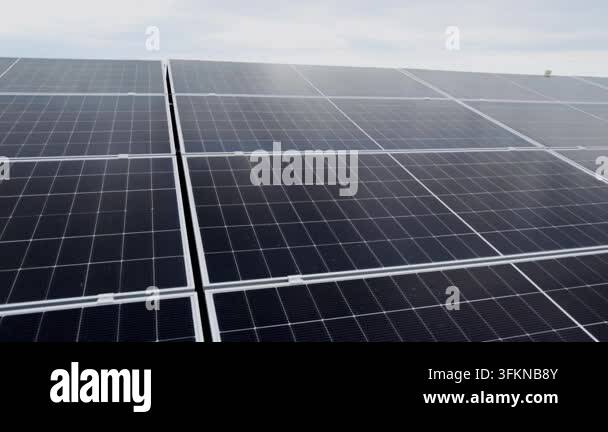 Close-up aerial view of a large solar panel array on a rooftop ...