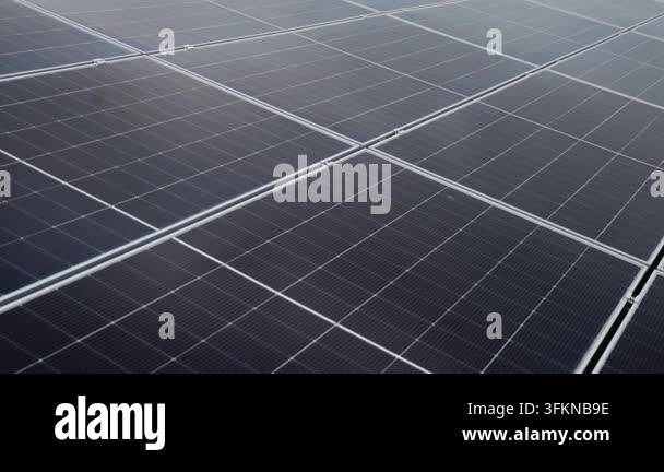 Close-up aerial view of a large solar panel array, showcasing the grid ...