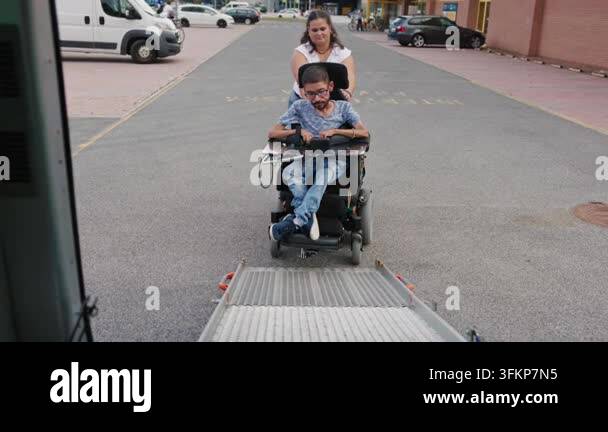 Vehicle Entry Ramp Vector Powered wheelchair user boarding an adapted vehicle with support from ...