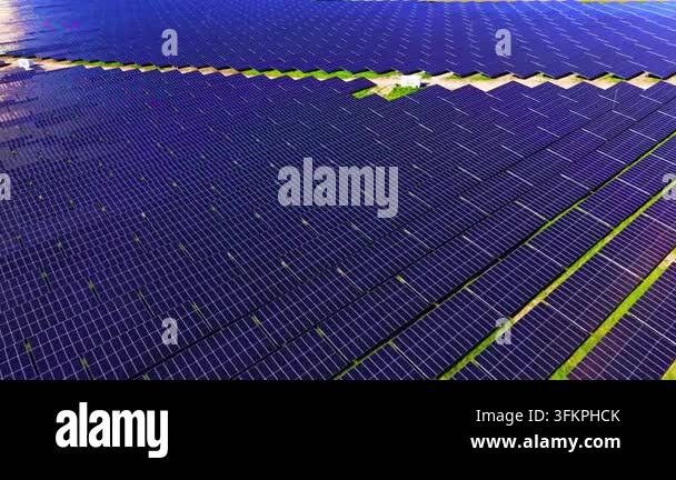 Close aerial view of solar panel array rows. Drone angle highlights ...
