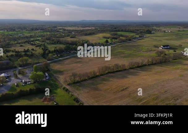 Aerial view across agricultural fields and rural landscape near ...