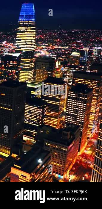 Downtown San Francisco skyline illuminated at night. Aerial drone view ...