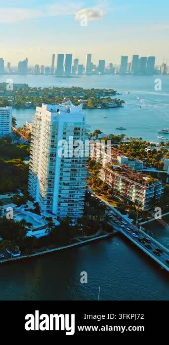 High rise tower, causeway and bay islands, Miami Beach. Drone view at ...