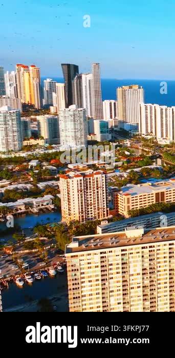 Sunset over high rise towers and marina, Sunny Isles Beach, Florida ...