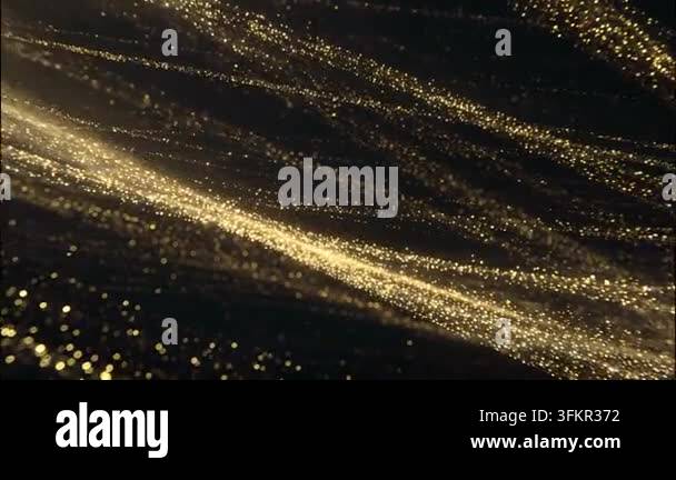 Shimmering golden particles flowing through dark background Stock Video ...