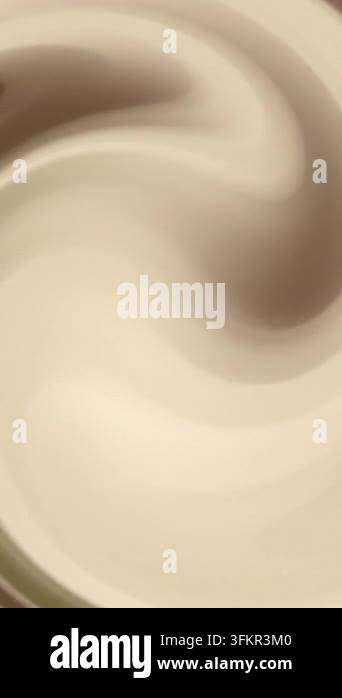 Seamless loop of abstract swirling liquid texture in creamy beige and ...