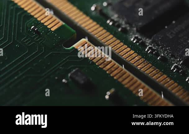 Extreme macro footage of two DDR4 RAM modules, showing gold contacts ...