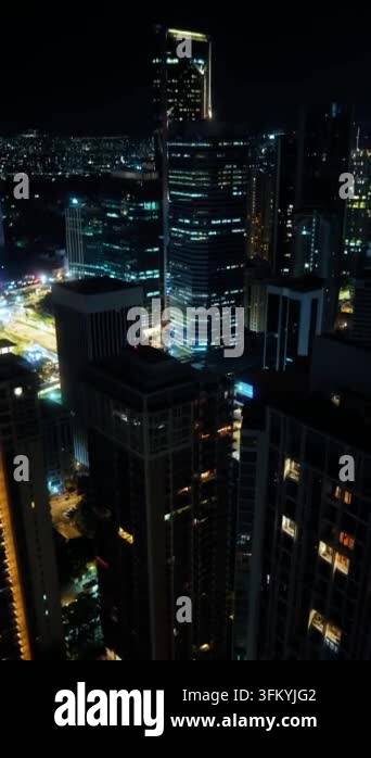 Urban skyscrapers illuminating dark city skyline at night Stock Video ...
