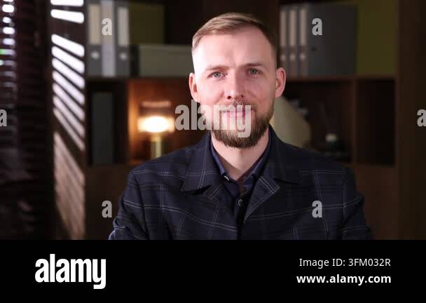 Smiling man wearing suit posing in office Stock Video Footage - Alamy