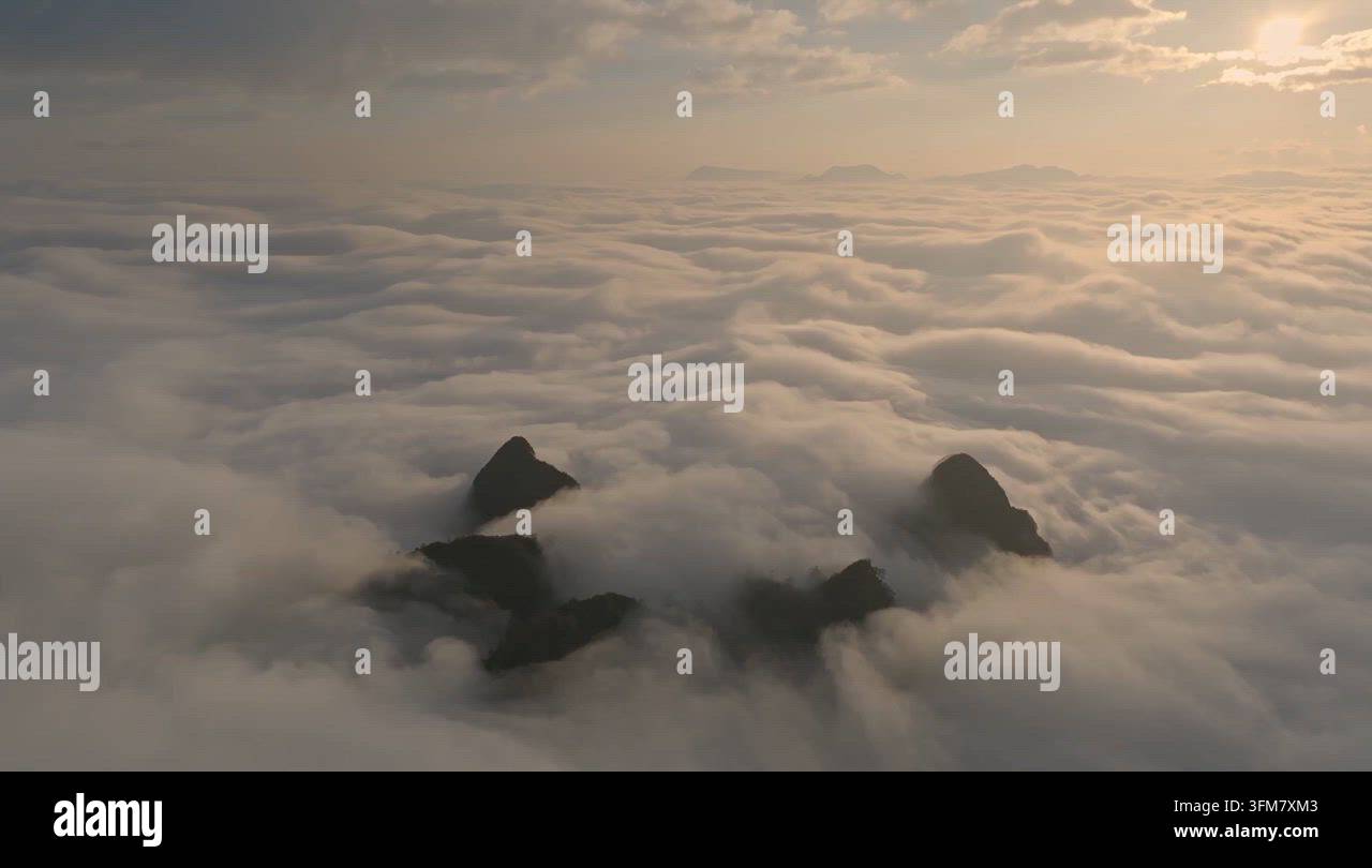 Sunrise Over Mountain Peaks Above a Sea of Clouds in Vietnam Stock ...
