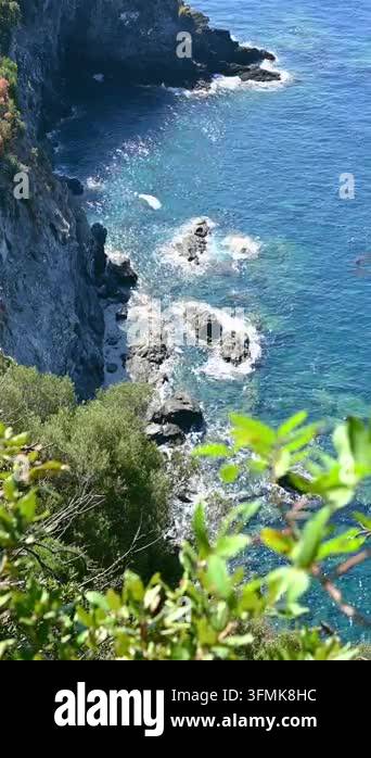 Rocky coastline waves crashing against cliffside mediterranean shore ...