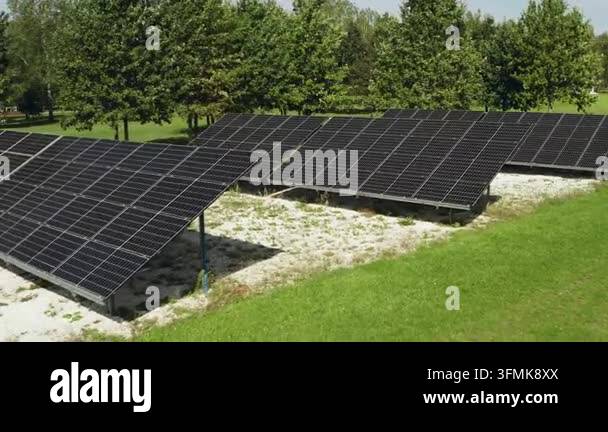 Rows of ground mounted solar panels generate renewable green ...