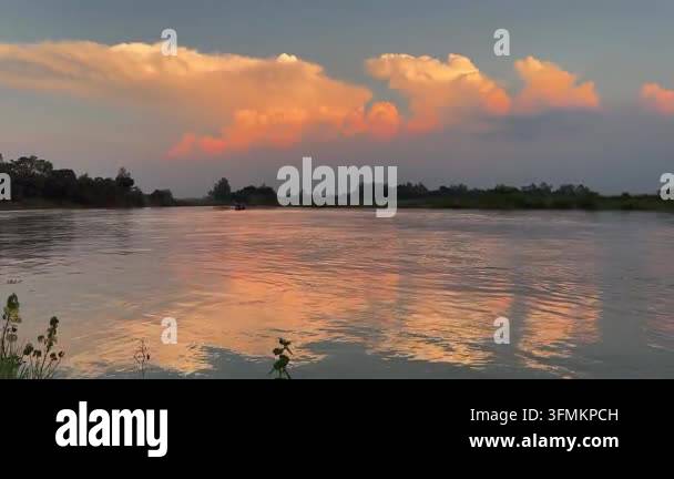 Golden Sunset Over Calm River With Beautiful Dramatic Clouds Sky Stock ...