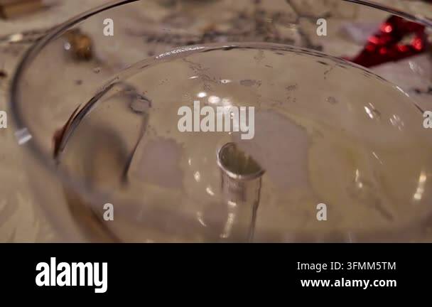 Champagne bubbles rising in coupe glass -- Close-up of champagne ...