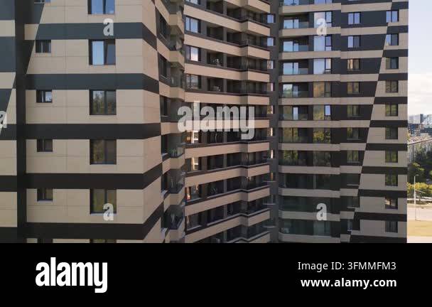 Facade of a modern multi-story residential building with windows ...