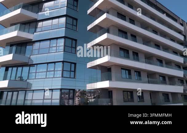 Close-up exterior view of a high-rise modern residential building with ...
