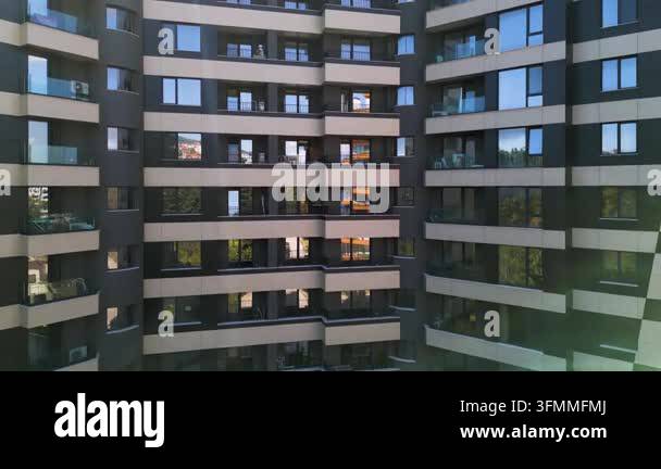 Facade of a modern multi-story residential building with windows ...