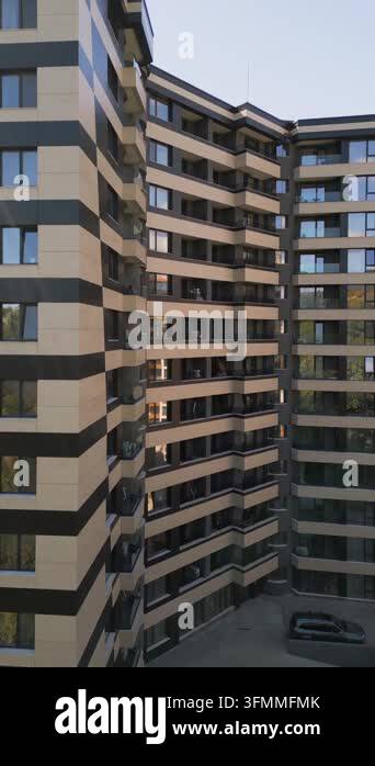 Facade of a modern multi-story residential building with windows ...