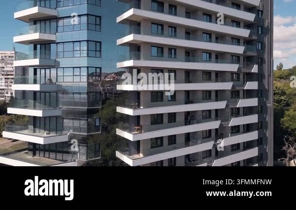 Close-up exterior view of a high-rise modern residential building with ...