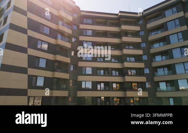 Facade of a modern multi-story residential building with windows ...