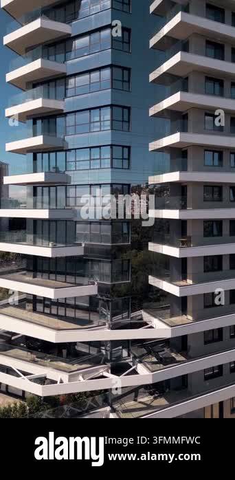 Close-up exterior view of a high-rise modern residential building with ...
